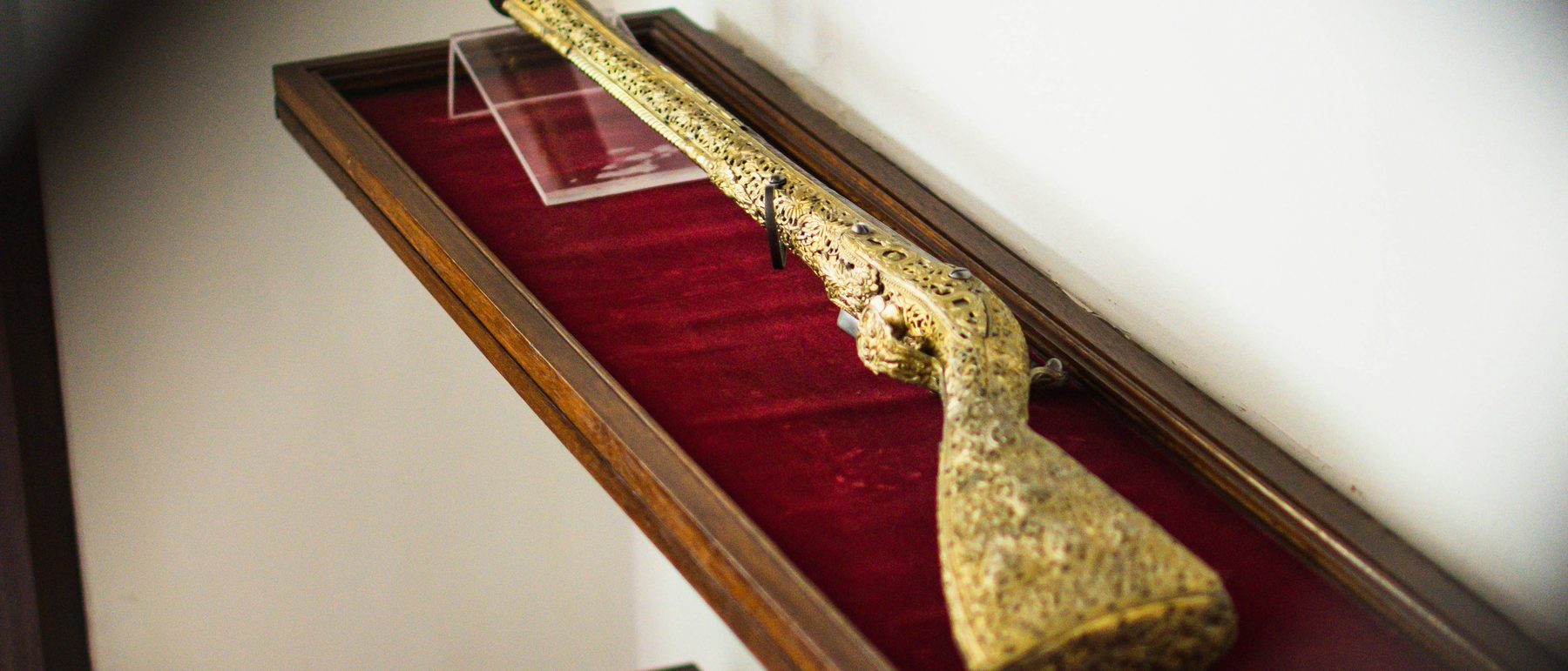 Antique arms in a fitted display case