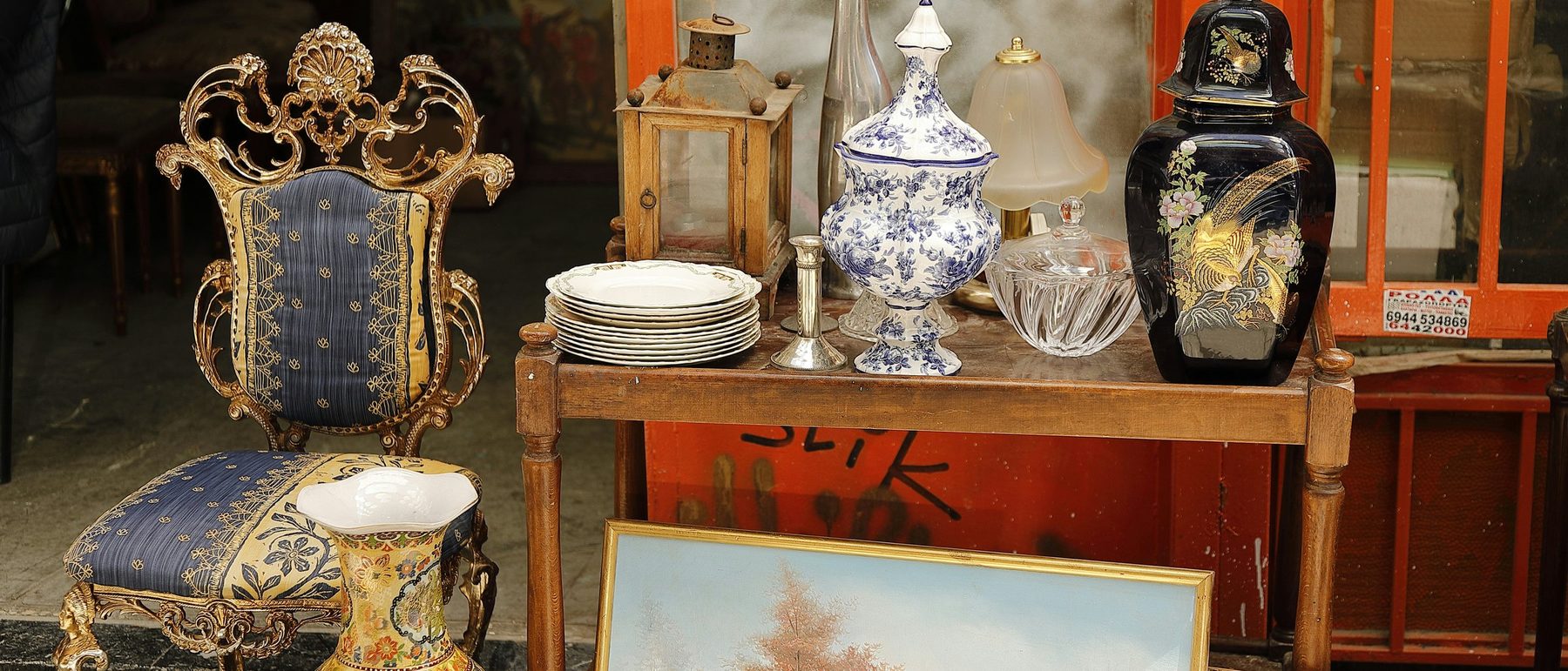 Assorted household objects, china and pictures set out together
