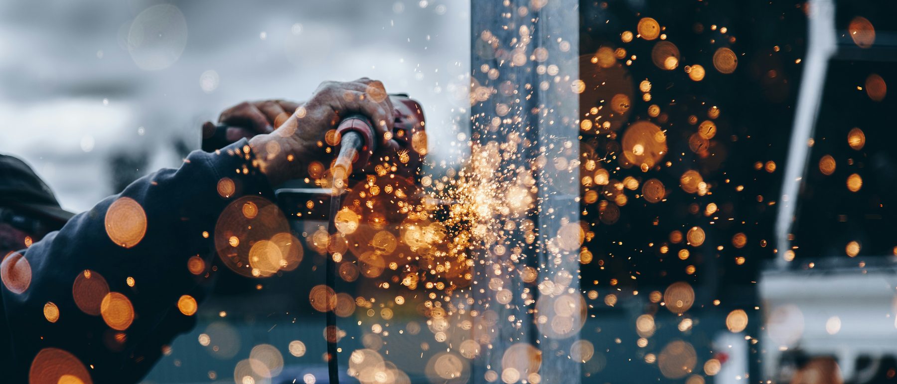 Grinding steel in a fabrication shop