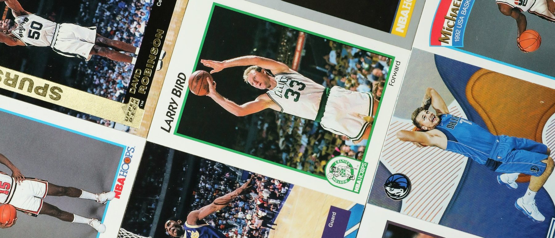 Basketball cards laid out in rows for cataloguing